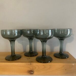 Vintage hand-blown smoky green coupe champagne cocktail glass.